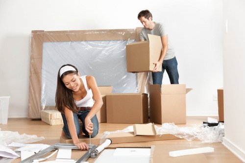 Boxes and furniture being assessed for a transparent storage quote in Wembley