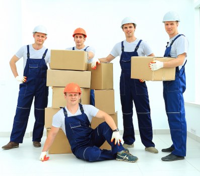 Organised storage unit in Wembley with packed boxes and furniture